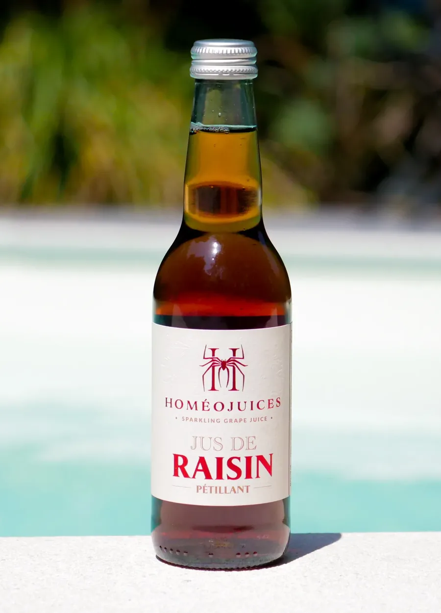 Bouteille Homéojuices Le Rouge, jus de raisin pétillant à la robe rouge rubis